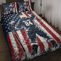 Hockey quilt blanket bedding set displayed on a bed with patriotic stars and stripes artwork