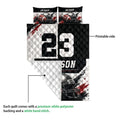 Football quilt shown folded to reveal the printed front and white quilted backing with helmet and football artwork