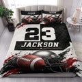 Football quilt blanket styled on a bedroom with bold black, white, and red sports artwork and football helmet details