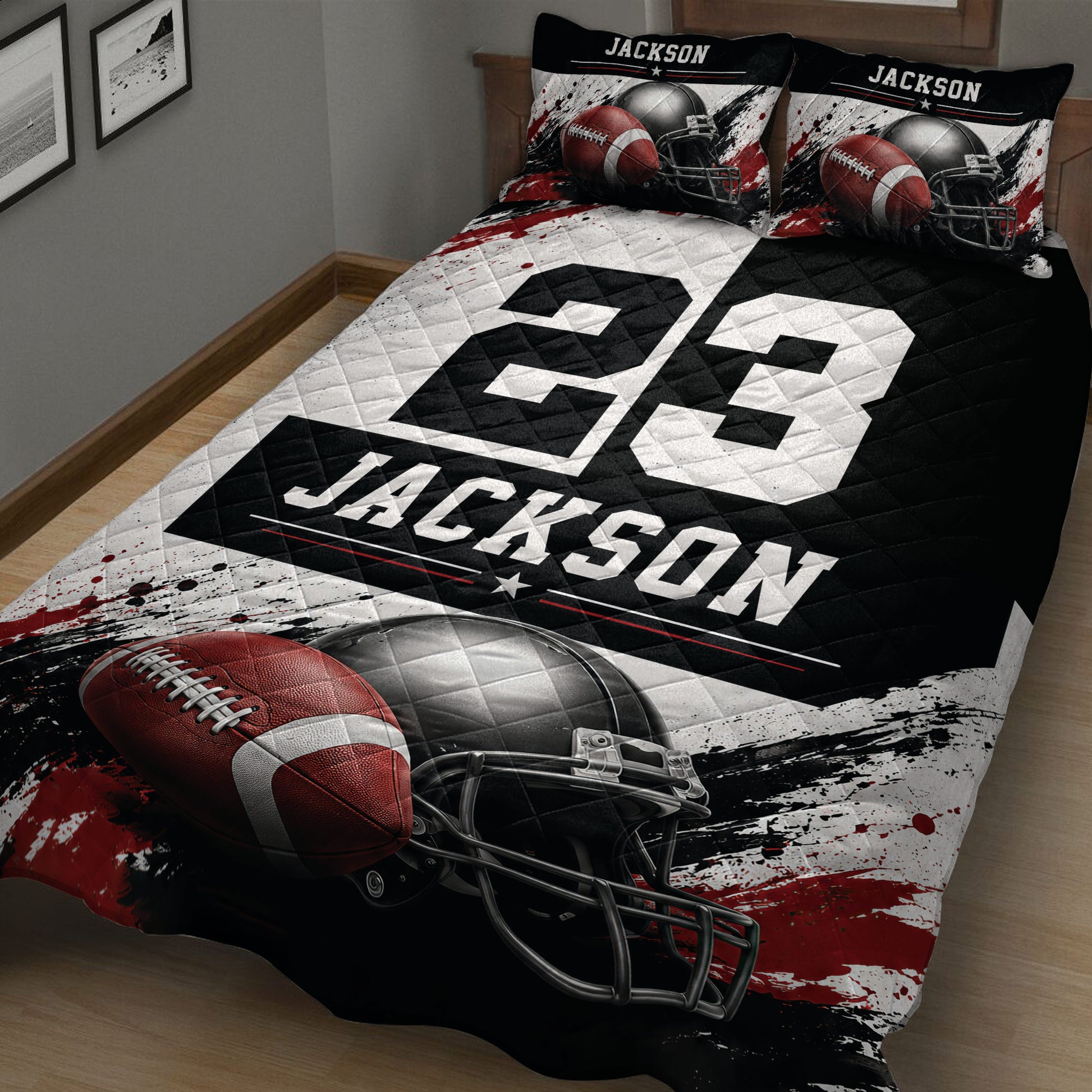 Close view of football quilt bedding with dramatic helmet and football artwork in black, white, and red
