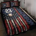 Baseball quilt blanket displayed on a bed with vintage American flag stripes, baseballs, bats, and stars