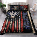 Baseball quilt blanket styled in a bright bedroom with patriotic colors, baseballs, bats, and stars