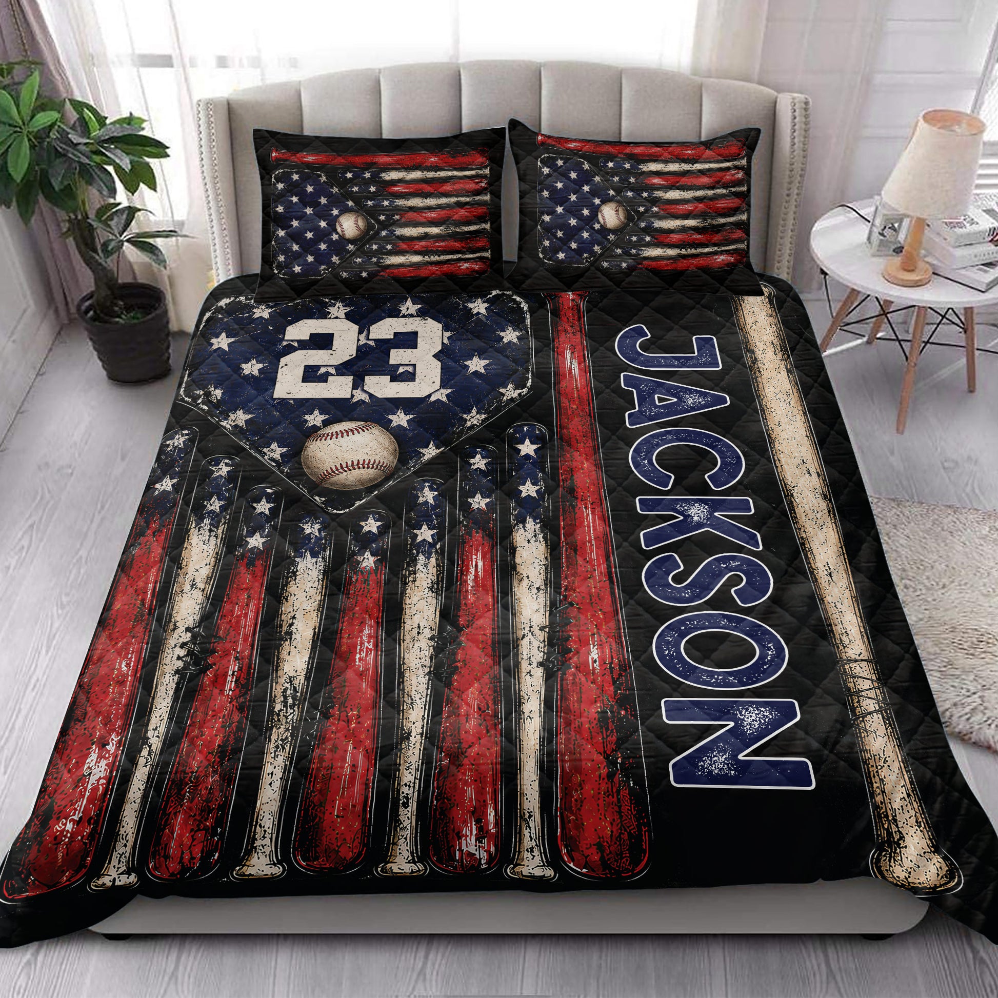 Baseball quilt blanket styled in a bright bedroom with patriotic colors, baseballs, bats, and stars
