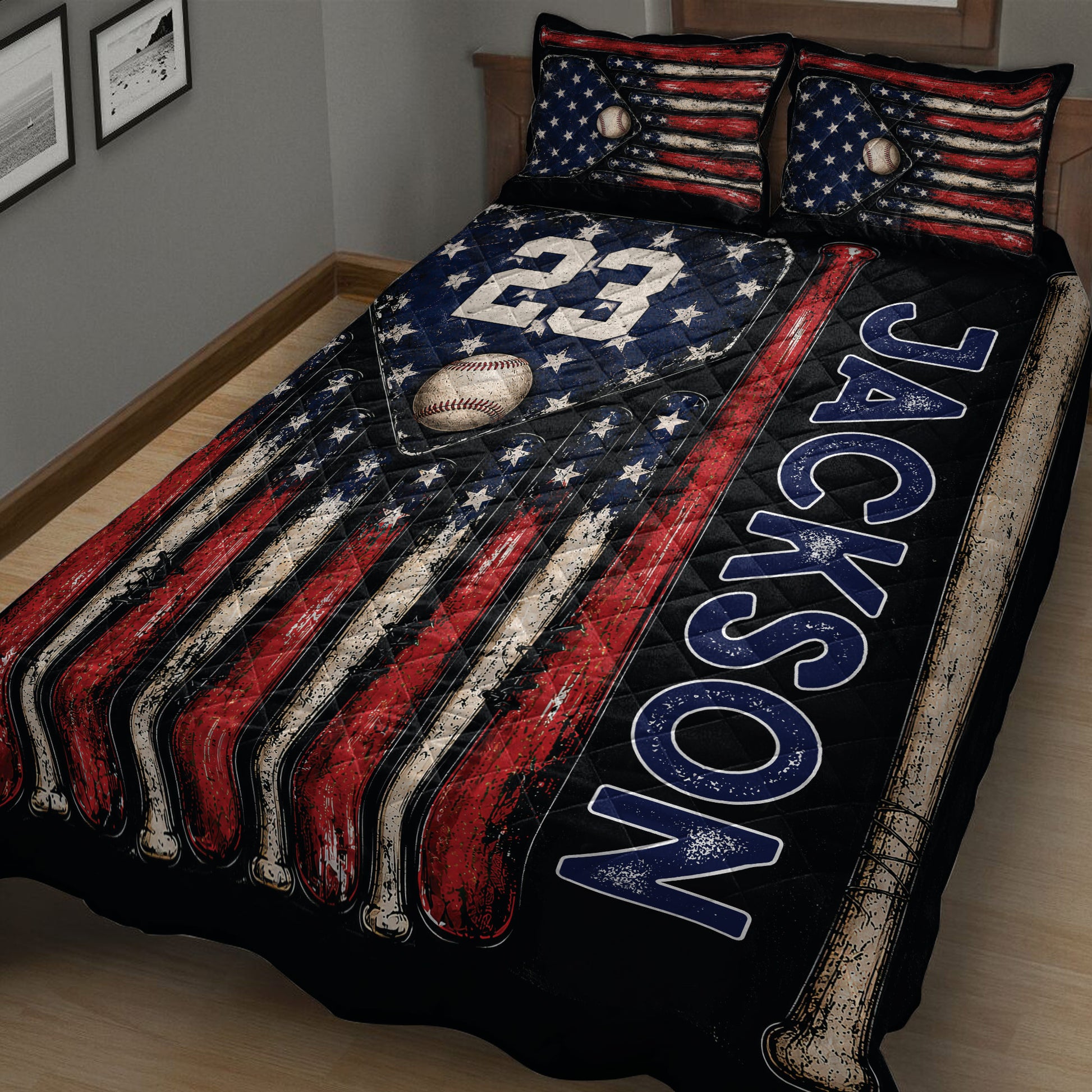 Close bedroom view of baseball quilt blanket featuring baseball bats, a baseball, stars, and flag-inspired stripes
