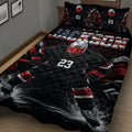 Close view of hockey player quilt blanket with skates, ice spray, and patriotic colors