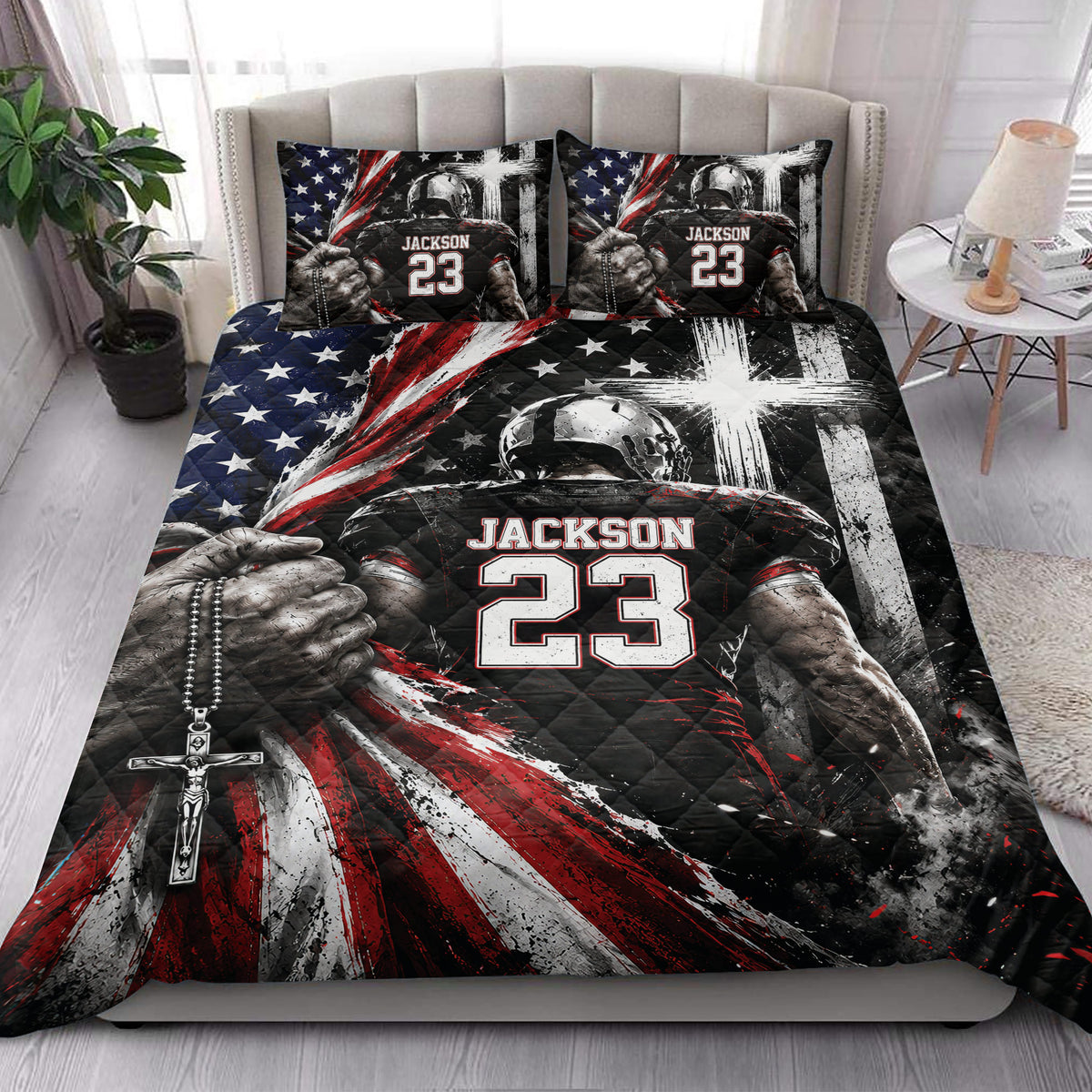 American football quilt blanket styled on a bedroom bed with dramatic black, red, white, and blue artwork