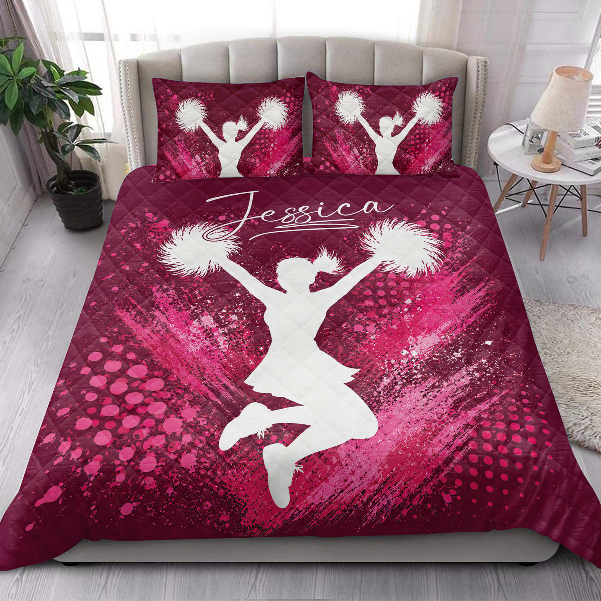 Pink cheerleading quilt blanket styled in a bright bedroom with a central cheerleader silhouette