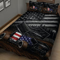 Close view of a dirt track racing quilt blanket featuring sprint cars, racing flags, stars, and dark track-inspired artwork