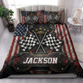Racing quilt bedding styled in a bright bedroom with checkered flags, patriotic colors, and dramatic motorsport artwork