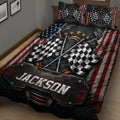 Close view of racing quilt bedding with large checkered flags, metallic details, patriotic stripes, and black red colors