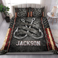 Fishing quilt bedding styled in a bright bedroom with matching hook artwork across the bed and pillows