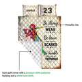 Softball quilt showing the printed front and white quilted backing in a product detail view