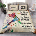 Softball quilt blanket styled in a bright bedroom with colorful batter artwork and sports typography