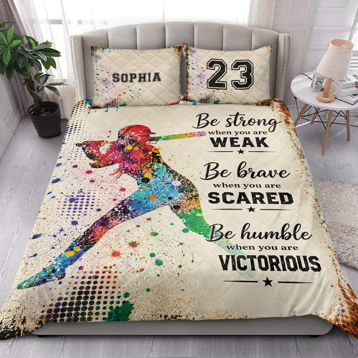 Softball quilt blanket styled in a bright bedroom with colorful batter artwork and sports typography