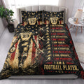 Football player quilt blanket styled on a modern bedroom bed with bold motivational sports artwork