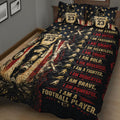 Close bedroom view of football quilt bedding with player artwork, stars, footballs, and bold red lettering