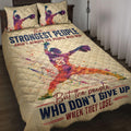 Softball quilt blanket displayed on a bed with colorful female pitcher artwork and motivational sports design
