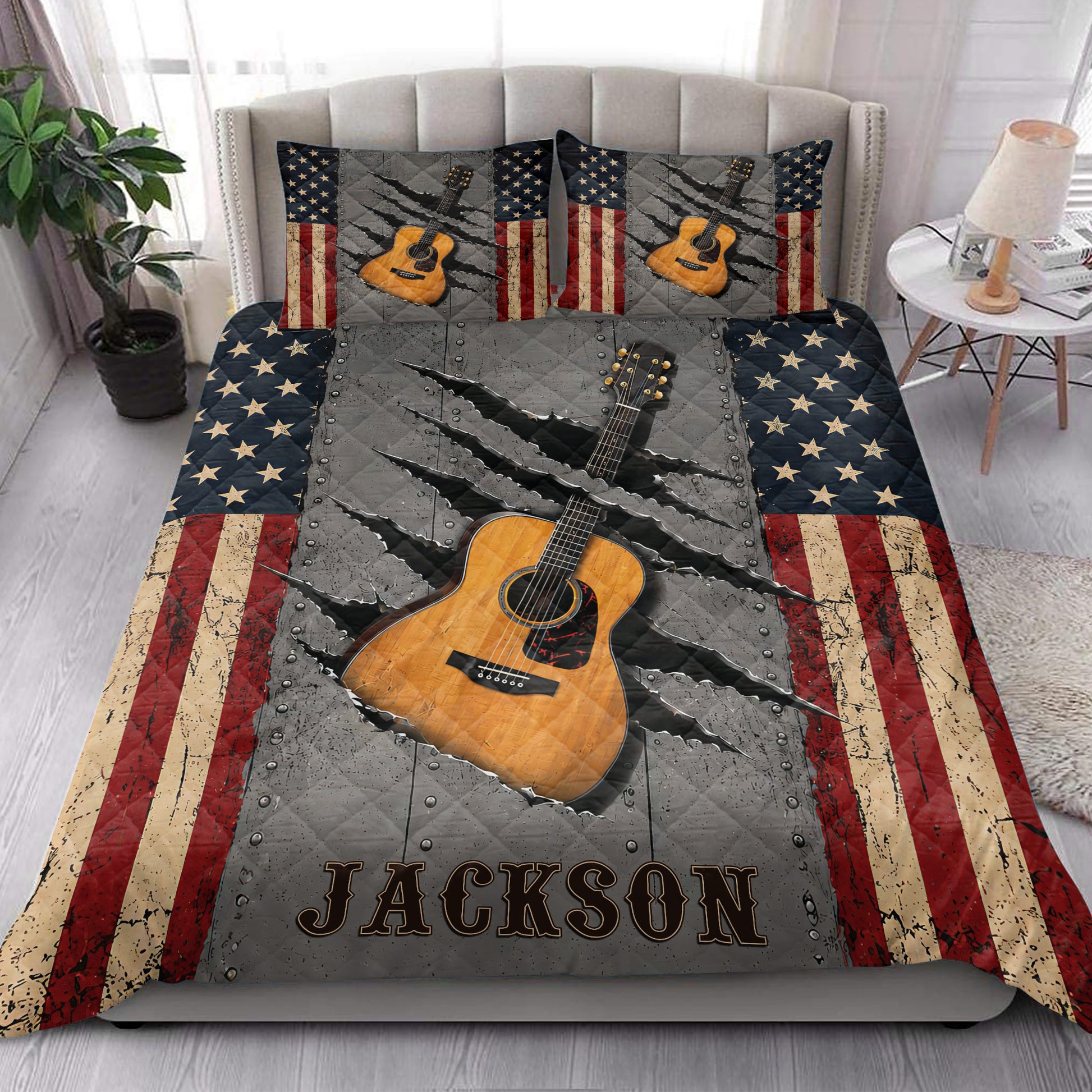Guitar quilt bedding styled in a bright bedroom with acoustic guitar artwork and rustic flag accents