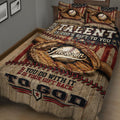 Close bedroom view of a baseball quilt blanket featuring vintage glove, ball, bat, and star artwork