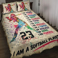 Colorful softball player quilt blanket displayed on a bed with motivational sports artwork