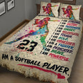 Close bedroom view of colorful softball quilt blanket featuring a batter and sports-inspired artwork