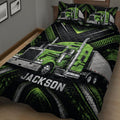 Close view of a green semi-truck quilt blanket with bold black and silver artwork