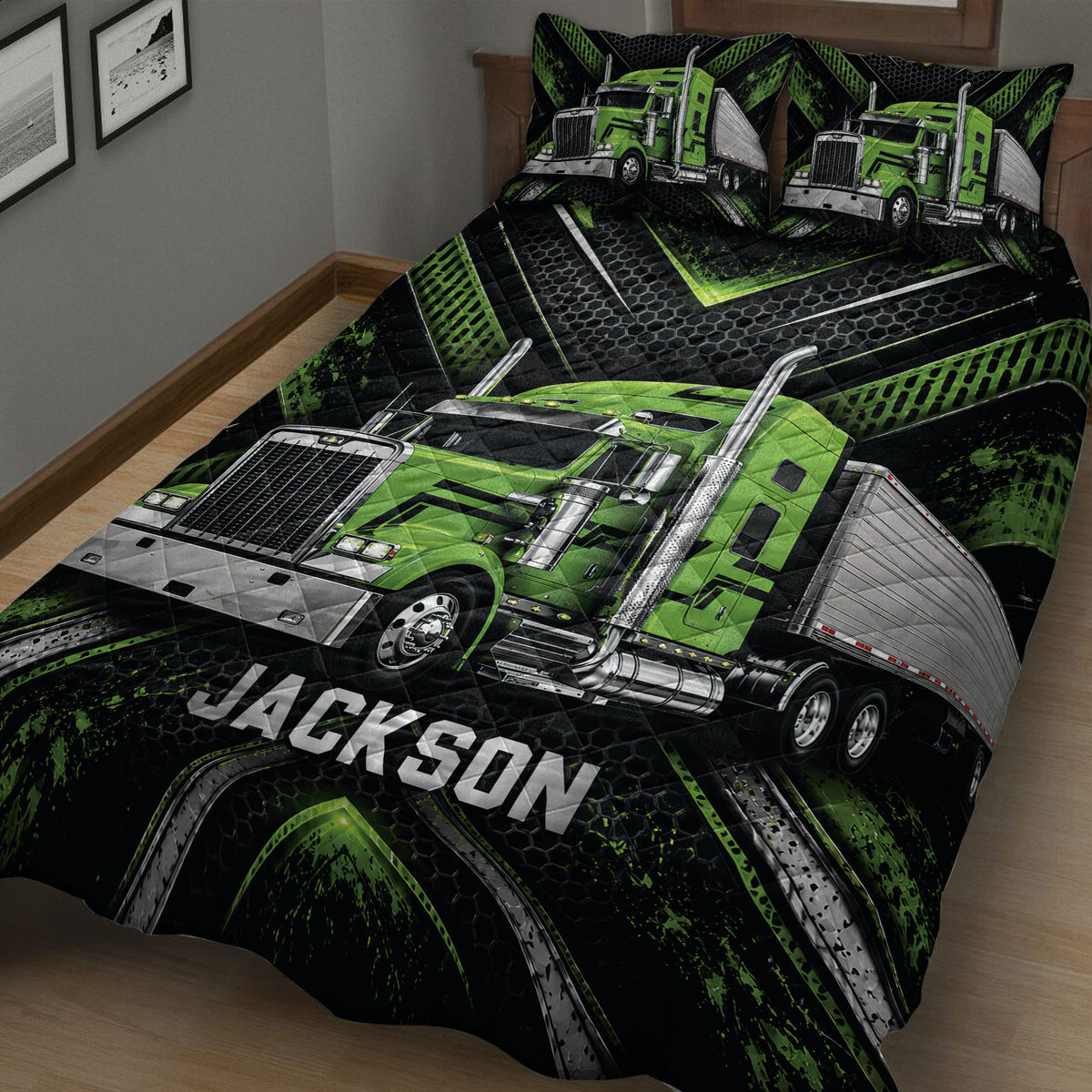 Close view of a green semi-truck quilt blanket with bold black and silver artwork