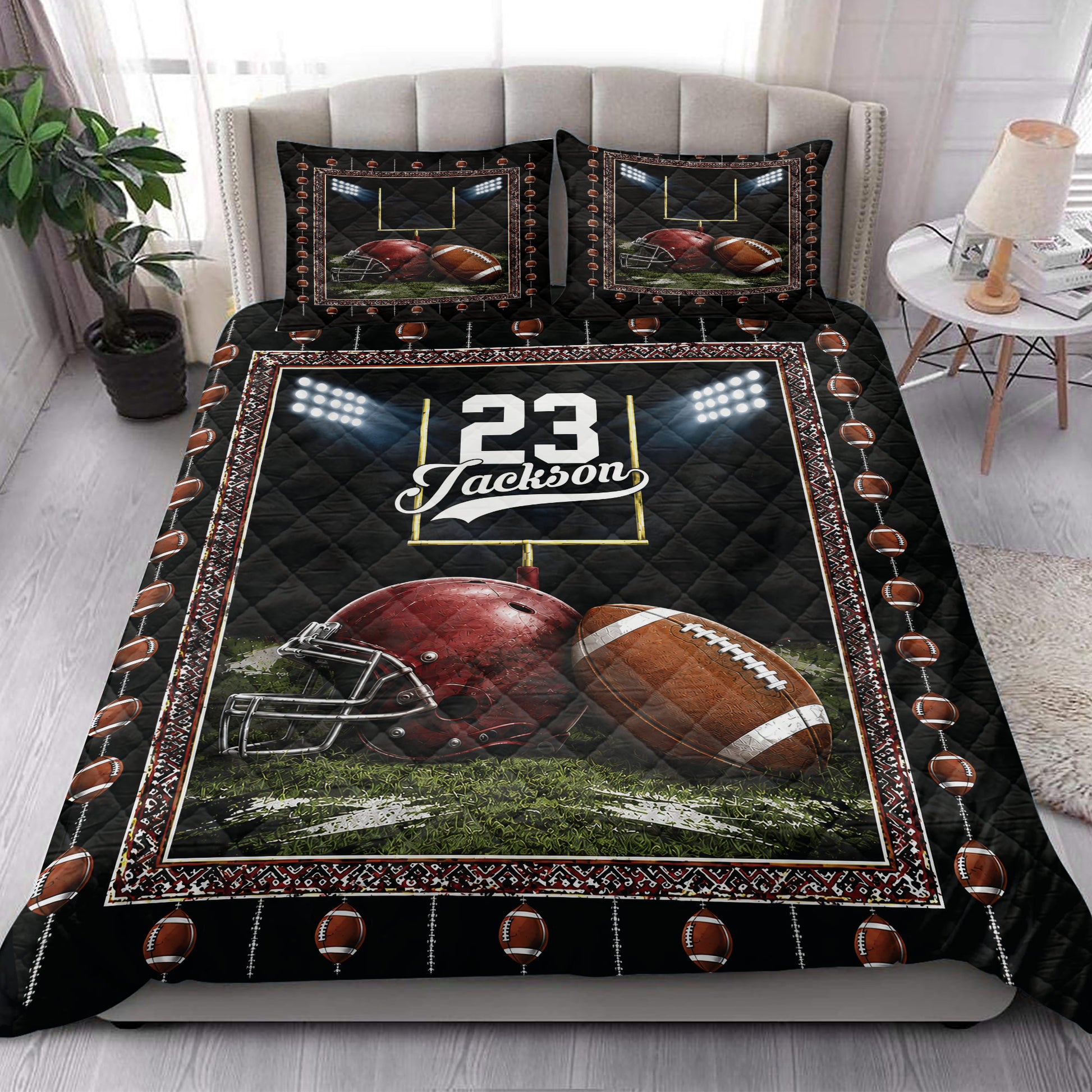 Football quilt blanket styled on a bedroom bed with helmet, football, goalpost, and stadium light artwork