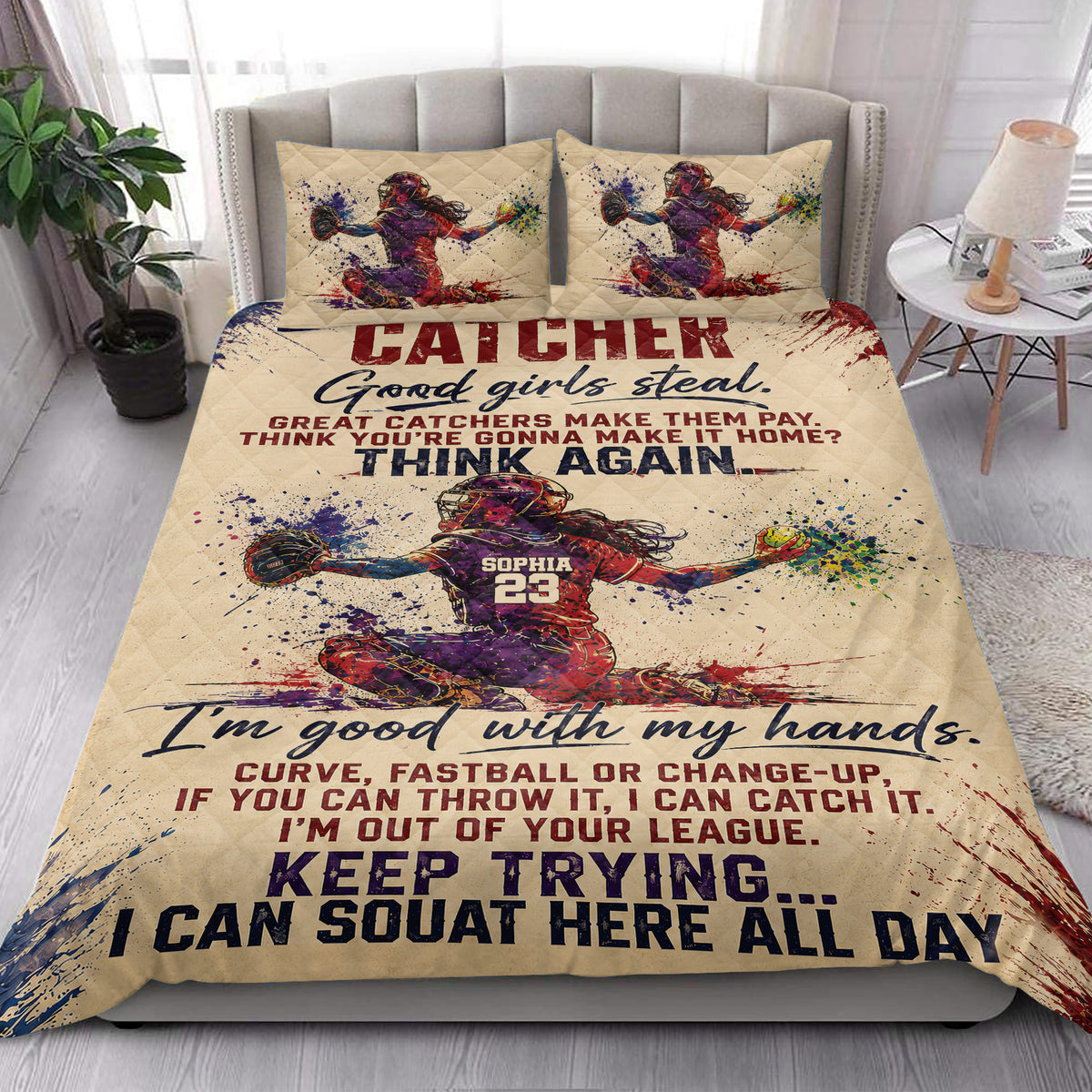 Softball catcher quilt bedding styled in a bright bedroom with colorful player artwork