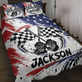 Racing quilt blanket displayed on a bed with crossed checkered flags and bold red, white, and blue artwork
