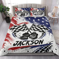 Racing quilt blanket styled in a bedroom with checkered flags and patriotic red, white, and blue design