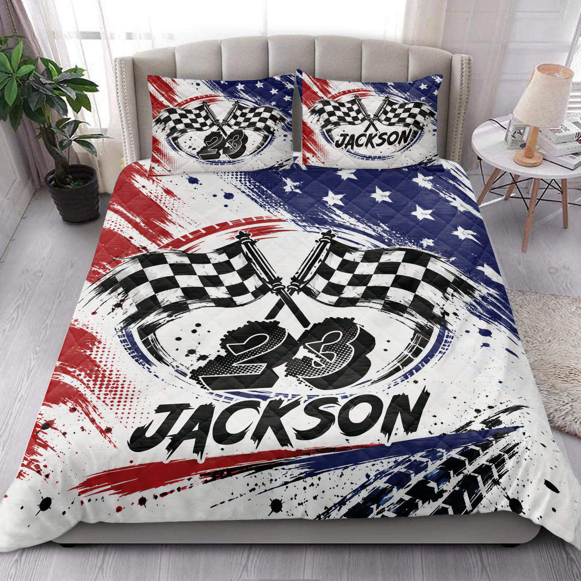 Racing quilt blanket styled in a bedroom with checkered flags and patriotic red, white, and blue design