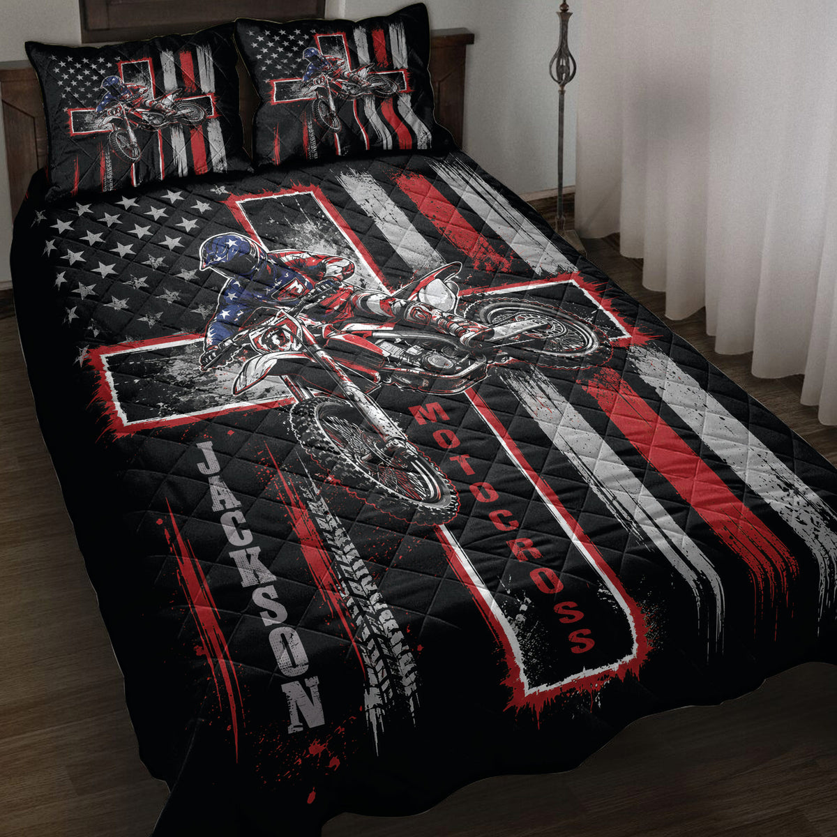 Motocross quilt bedding set displayed on a bed with dirt bike rider artwork in black, red, white, and blue