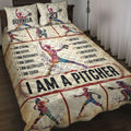 Softball quilt blanket displayed on a bed with colorful female player artwork, baseball diamond accents, and motivational sports graphics