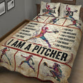 Close bedroom view of a softball quilt blanket featuring pitcher, batter, catcher, red field lines, and vibrant sports artwork