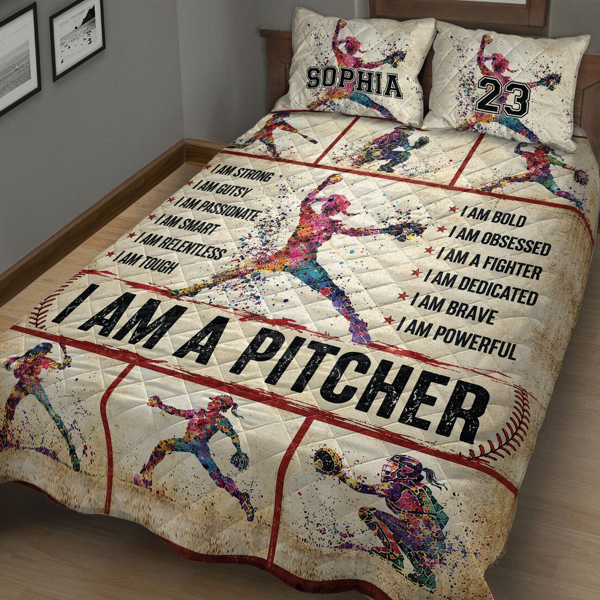 Close bedroom view of a softball quilt blanket featuring pitcher, batter, catcher, red field lines, and vibrant sports artwork