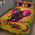 Angled bedroom view of a colorful softball quilt blanket with catcher and softball design