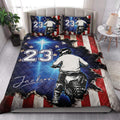 Motocross quilt bedding styled in a bedroom with dirt bike rider artwork and bold red white blue accents
