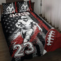 Football quilt bedding set displayed on a bed with red, black, and white player artwork
