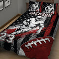 Close bedroom view of a football quilt with player artwork, stars, football graphics, and bold colors