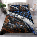 Dirt track racing quilt blanket styled in a bright bedroom with sprint car and checkered flag artwork