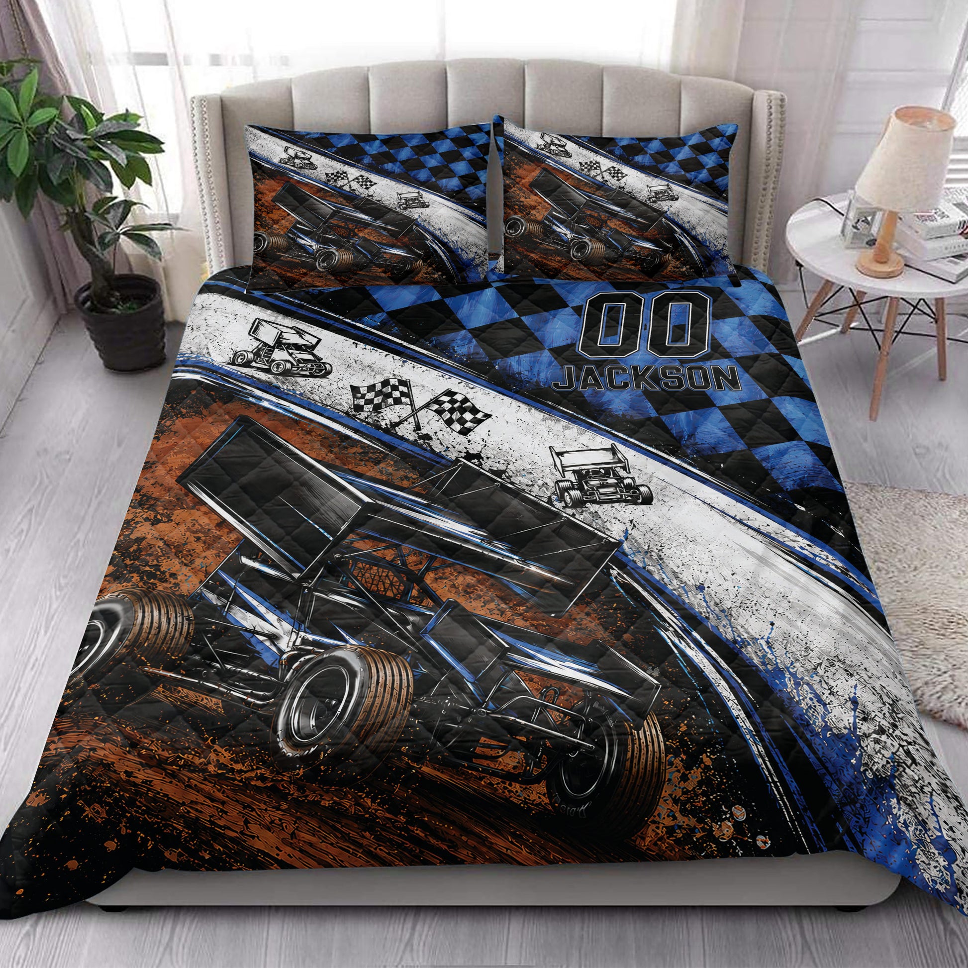 Dirt track racing quilt blanket styled in a bright bedroom with sprint car and checkered flag artwork