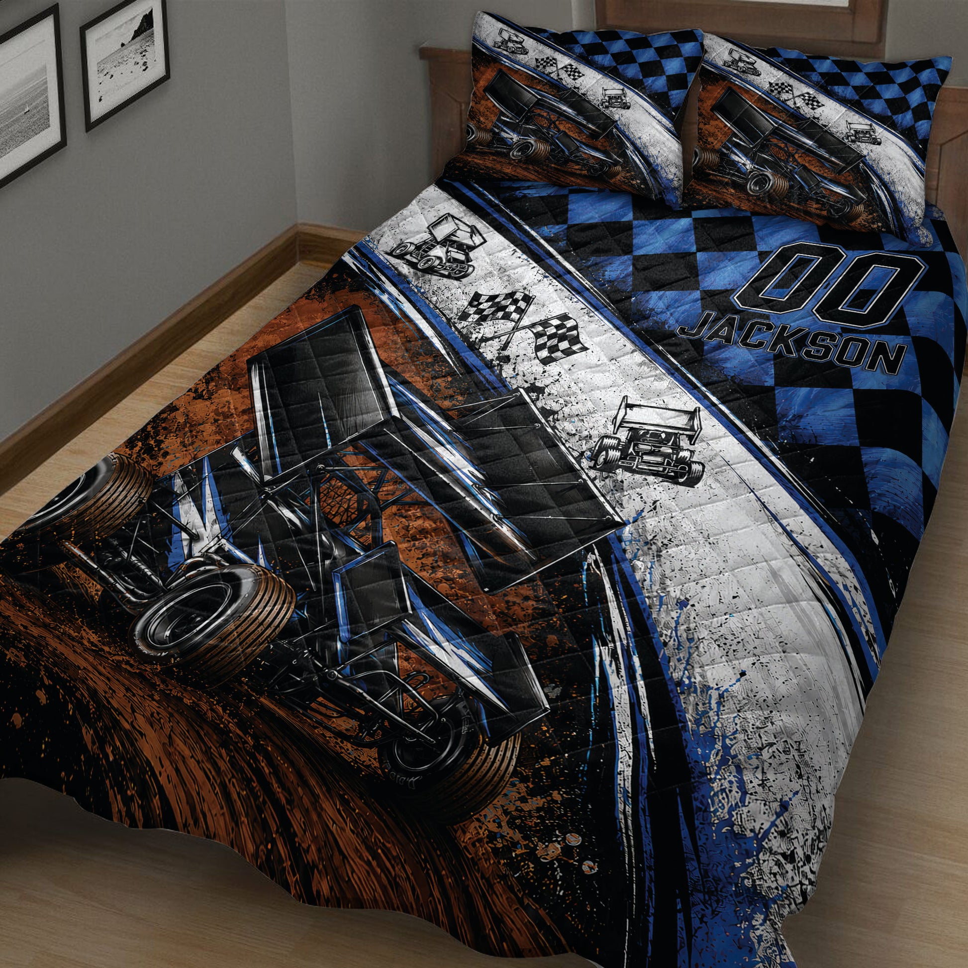 Close bedroom view of a dirt track racing quilt with sprint cars, racing flags, and blue black checkered pattern