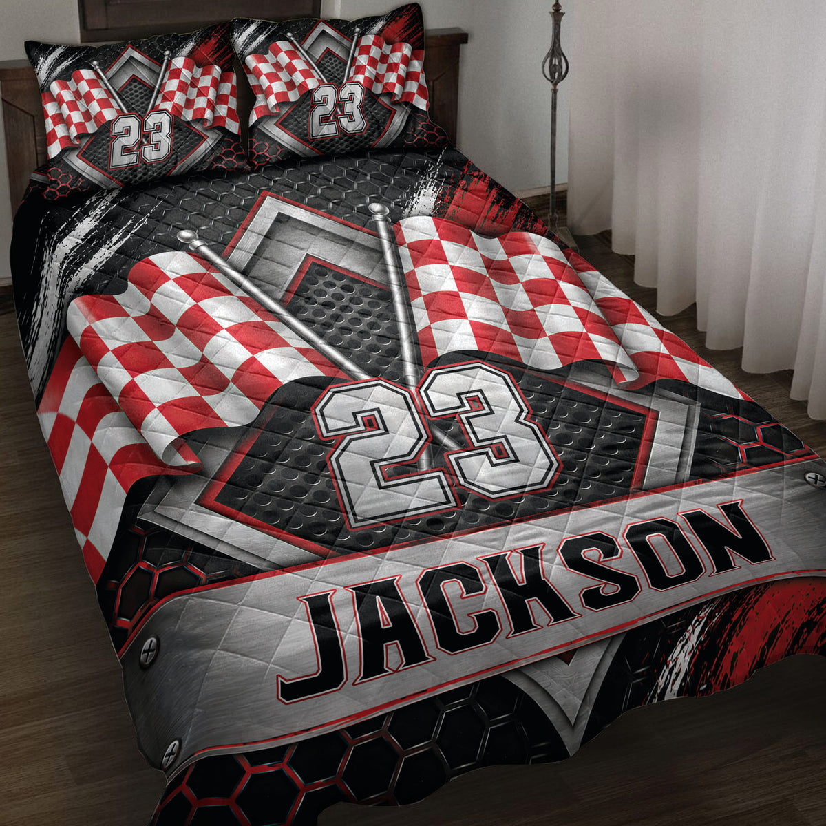Racing quilt blanket on a bed with red and white checkered flags, metallic accents, and bold sports graphics