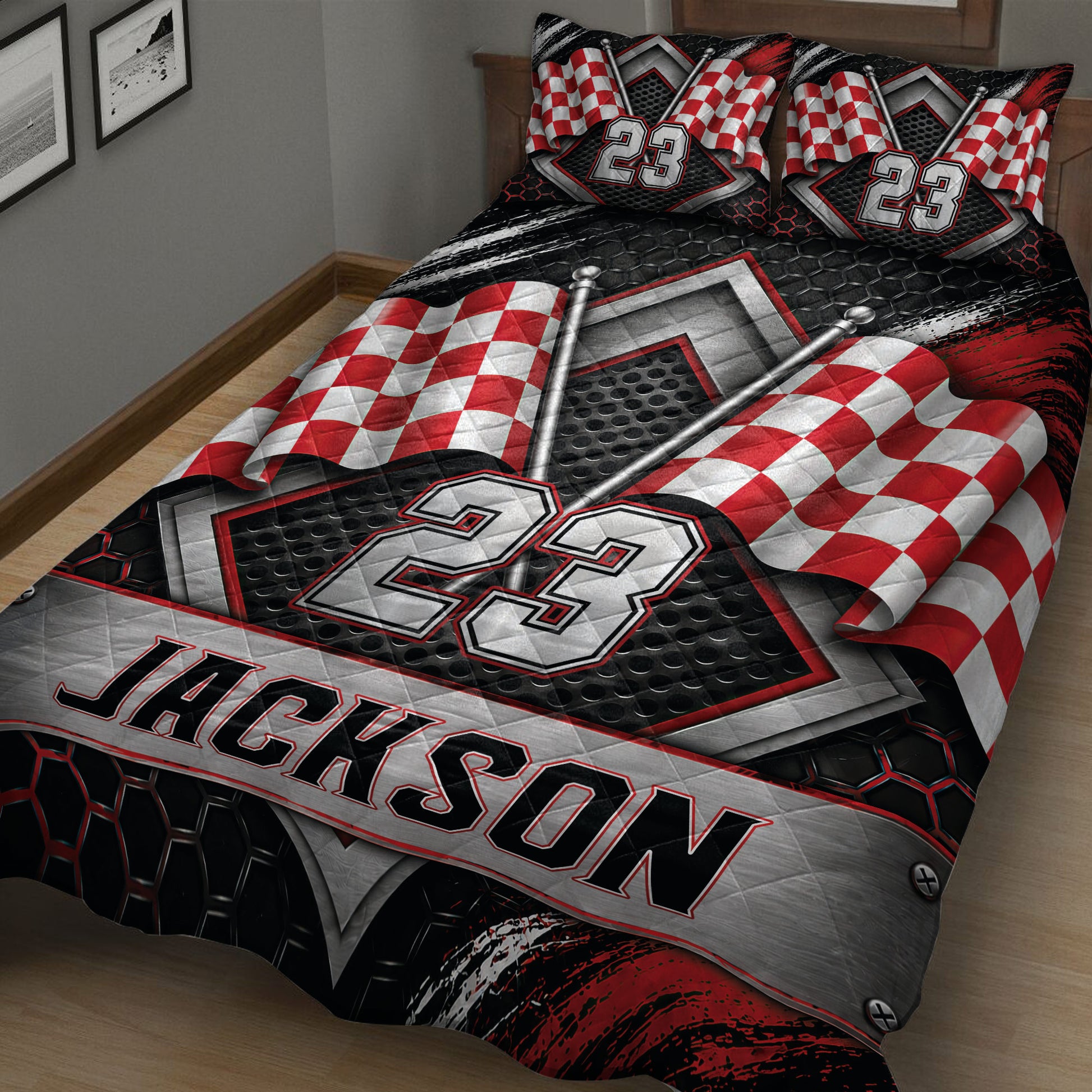 Close view of racing quilt bedding with red checkered flags, metallic details, and dramatic motorsport artwork