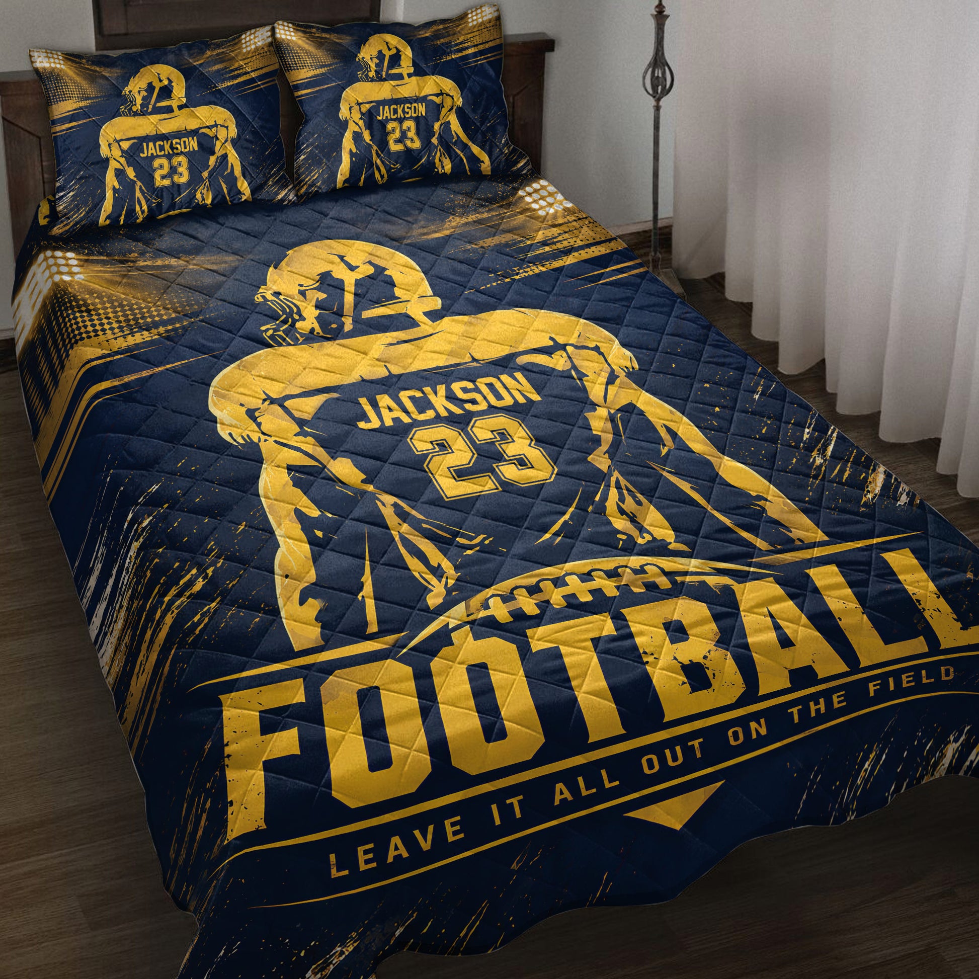 Navy and gold football quilt bedding set displayed on a bedroom bed with player artwork