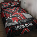 Custom trucker quilt blanket displayed on a bed with red semi-truck artwork and black geometric accents