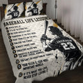 Baseball quilt blanket displayed on a bed with batter artwork, motivational lessons, and black, white, and gold accents