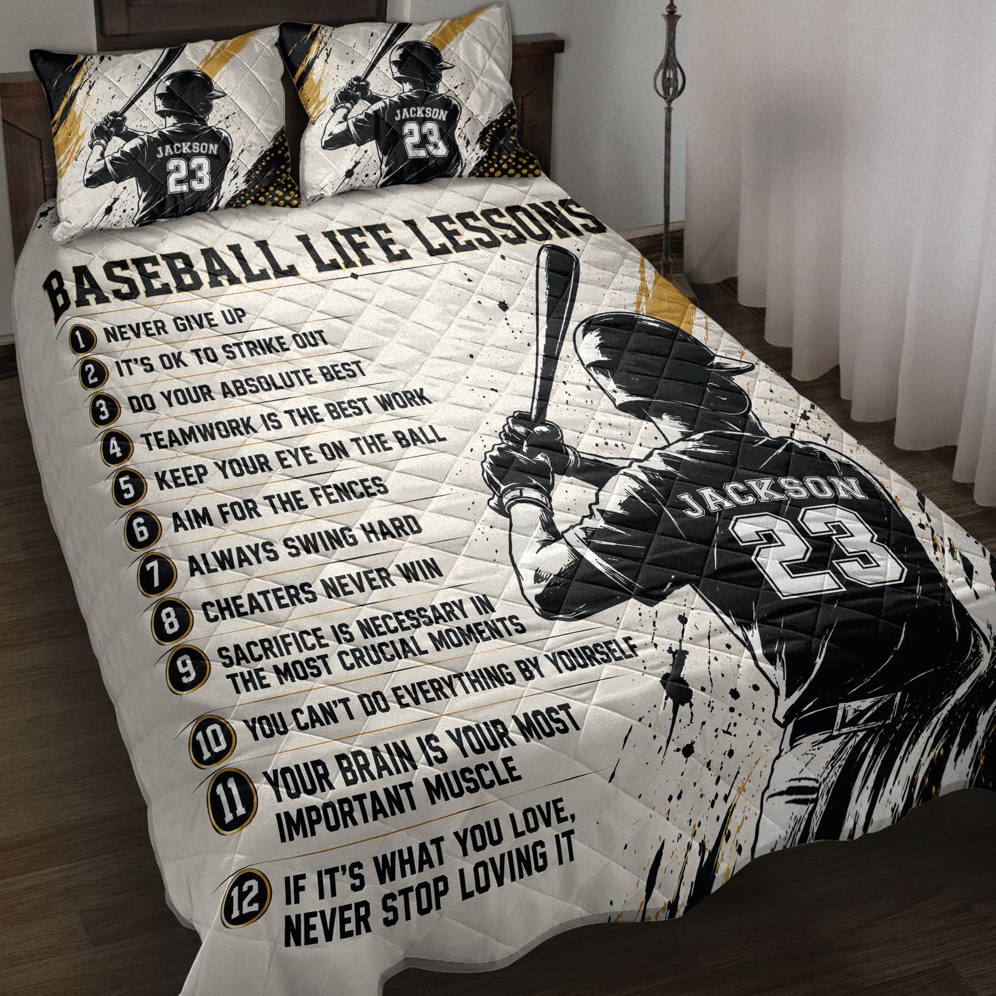 Baseball quilt blanket displayed on a bed with batter artwork, motivational lessons, and black, white, and gold accents