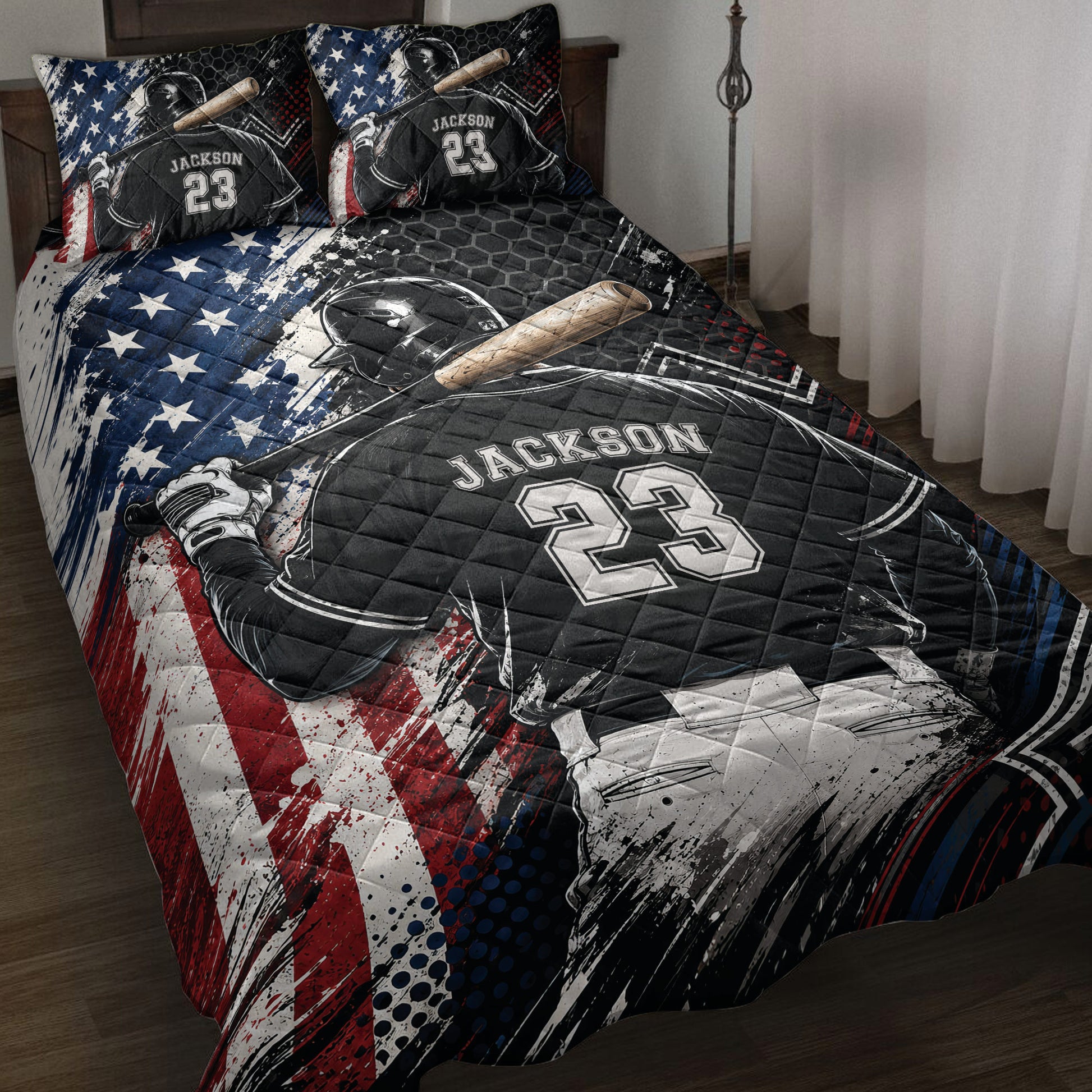 Baseball quilt blanket displayed on a bed with batter artwork in bold black, red, blue, and white